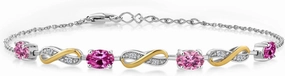 Gem Stone King 925 Silver and 10K Yellow Gold Oval Pink Moissanite Created Sapphire Pink and Lab Grown Diamond Tennis Bracelet For Women (1.97 Cttw, Fully Adjustable Up to 7.5 Inch)